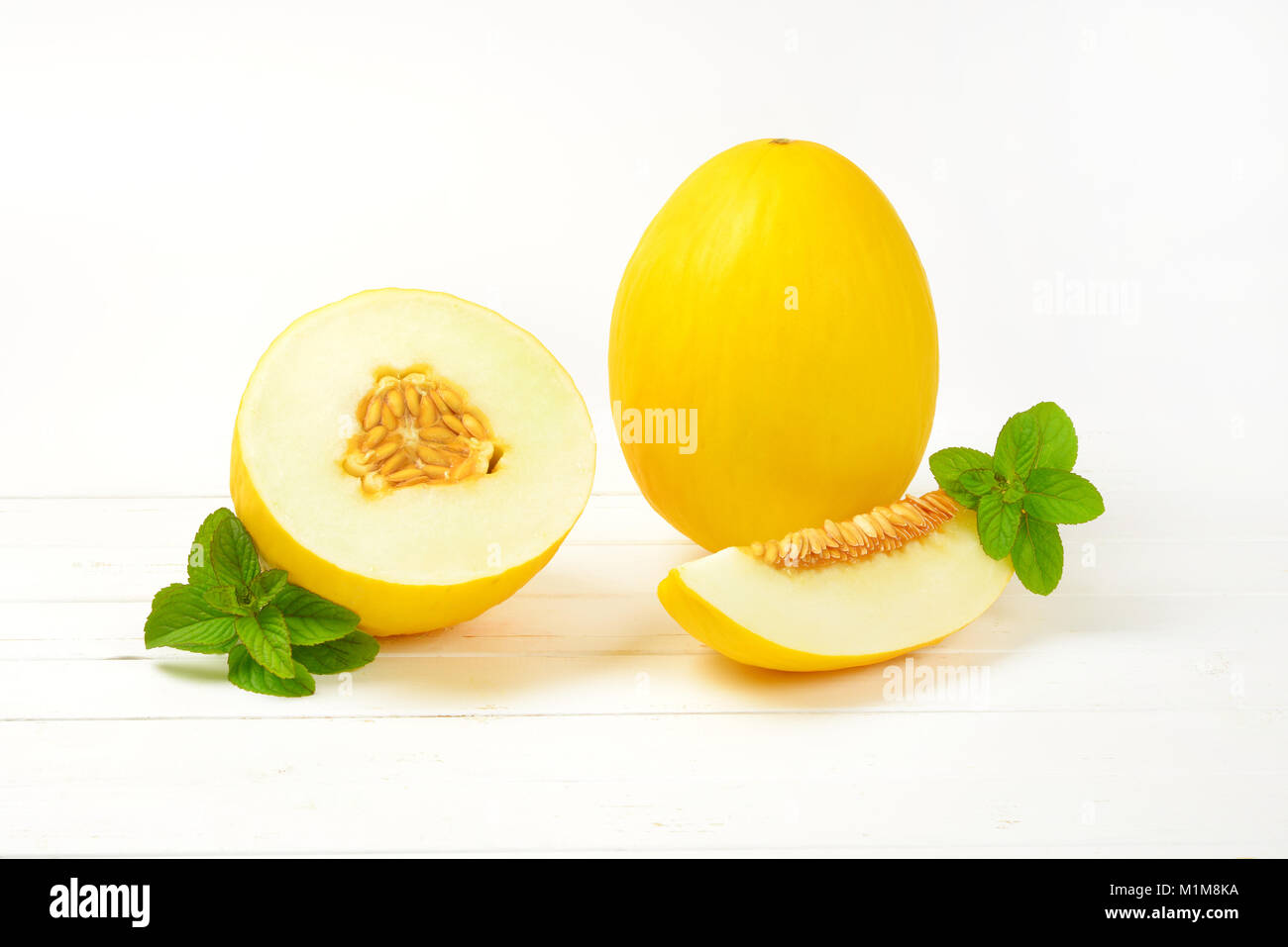 fresh yellow melons - whole, half and slice Stock Photo