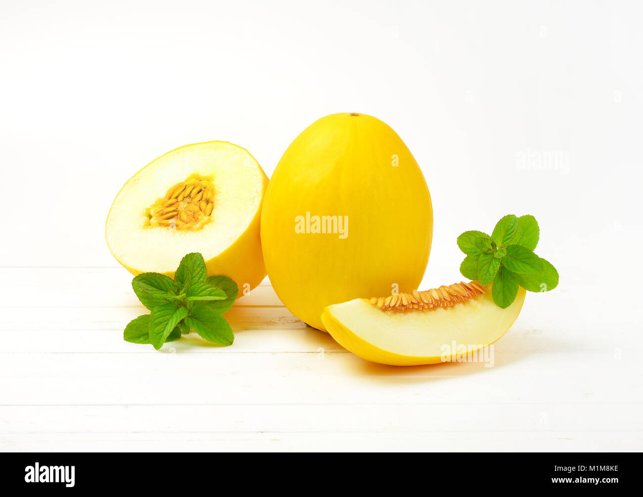 fresh yellow melons whole, half and slice Stock Photo Alamy