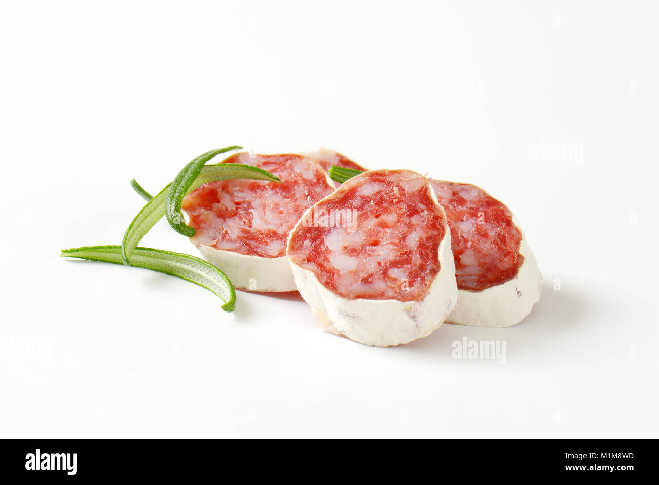 Slices of Spanish thin dried sausage Stock Photo