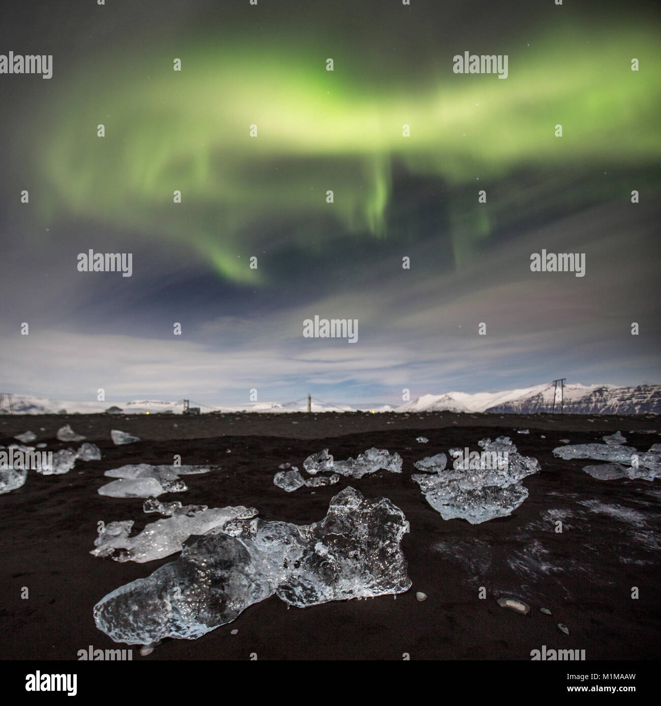 Aurora Borealis or Northern Lights on the ice beach at Jokulsarlon Stock Photo