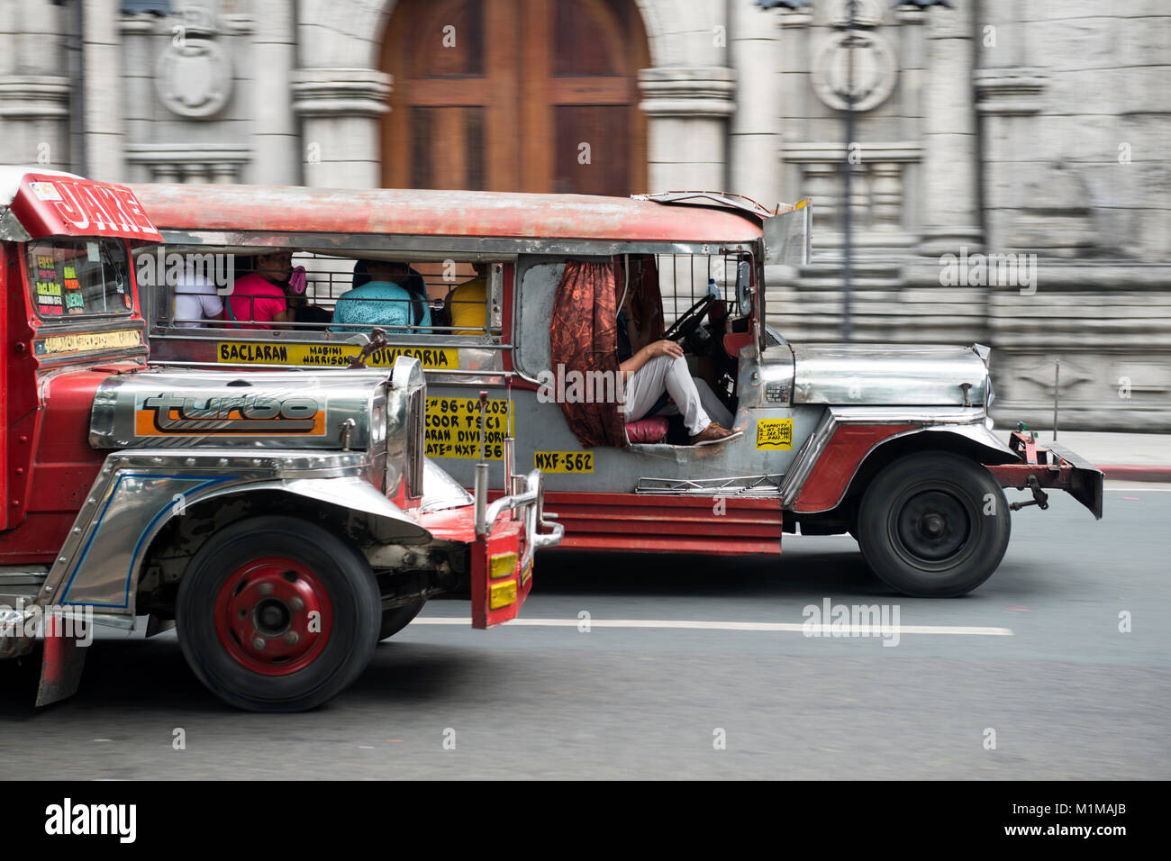 Jeepneys passing Malate Catholic Church, Metropolitain Manila, the Philippines. Stock Photo