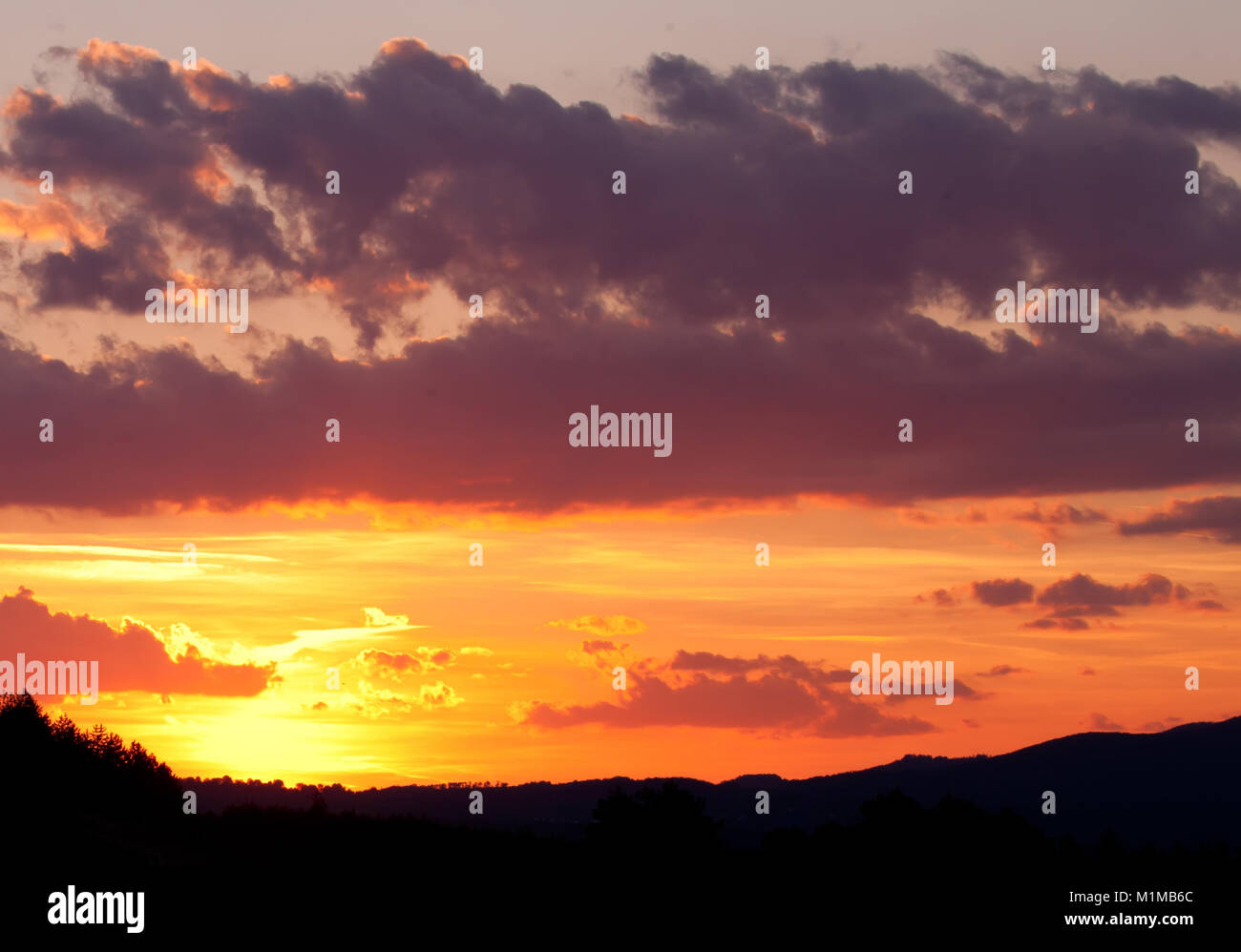 Fiery orange sunset sky Stock Photo - Alamy
