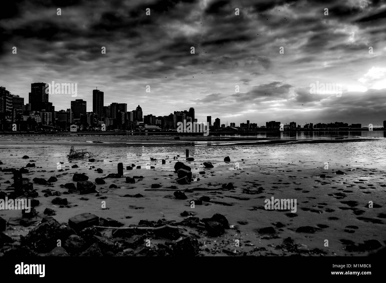Dramatic harbor sunrise, black & white Stock Photo