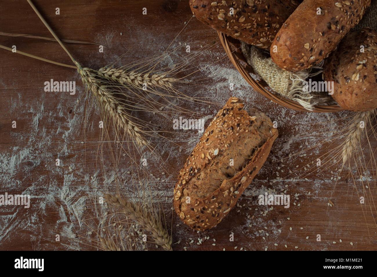 Fresh bread with different seeds on rustic wooden background Stock ...