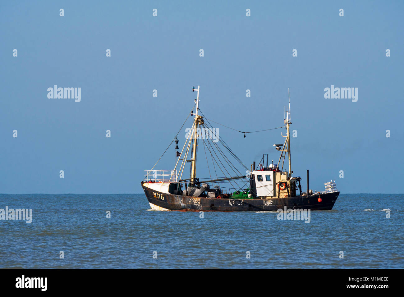 Shrimp trawler / shrimper fishing for shrimps in the North Sea along the Belgian coast near Nieuwpoort / Nieuport, West Flanders, Belgium Stock Photo