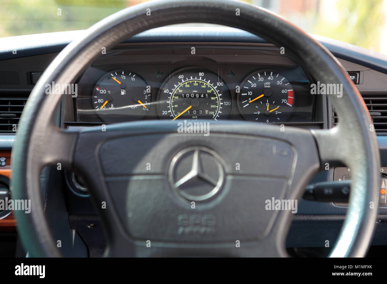 Mercedes 190e steering wheel and dials on a 1993 car pictured in the UK 2017. Stock Photo
