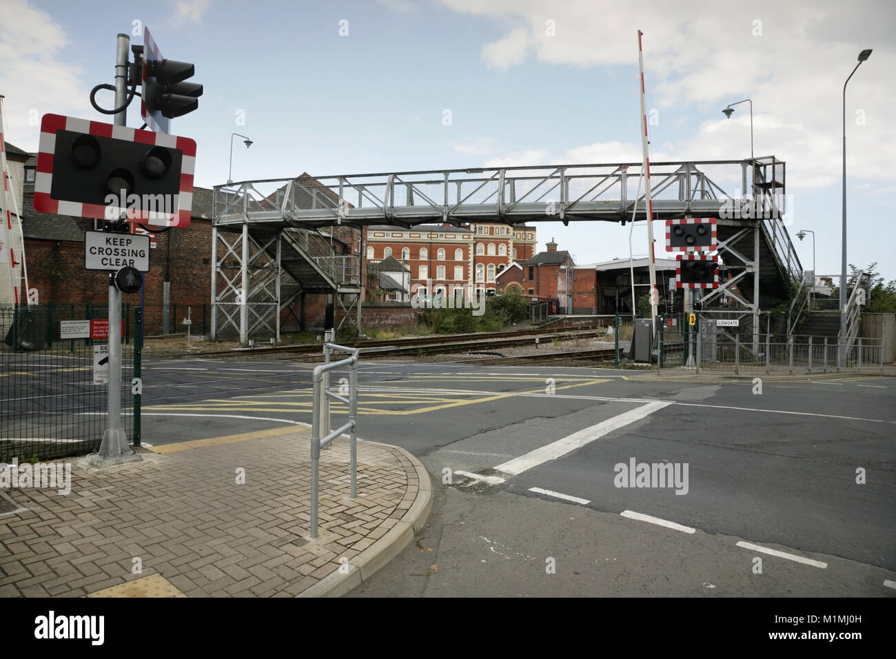 Wellowgate railway footbridge and level crossing, Grimsby, UK. Stock Photo