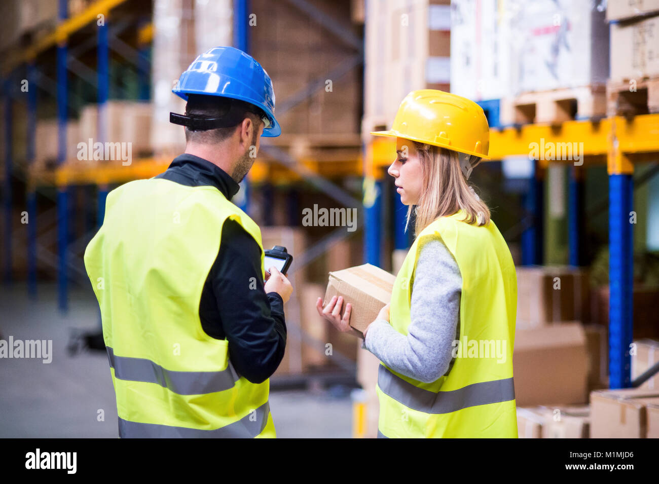Young Warehouse Workers Working Together Stock Photo Alamy young-warehouse-workers-working-together-stock-photo-alamy