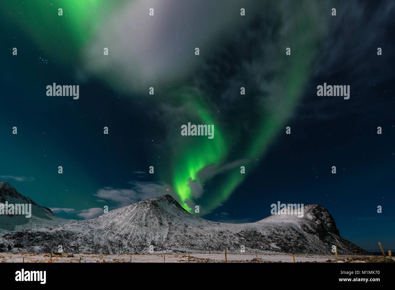 Northern lights over mountains, Myrland, Flakstad, Lofoten, Norway Stock Photo