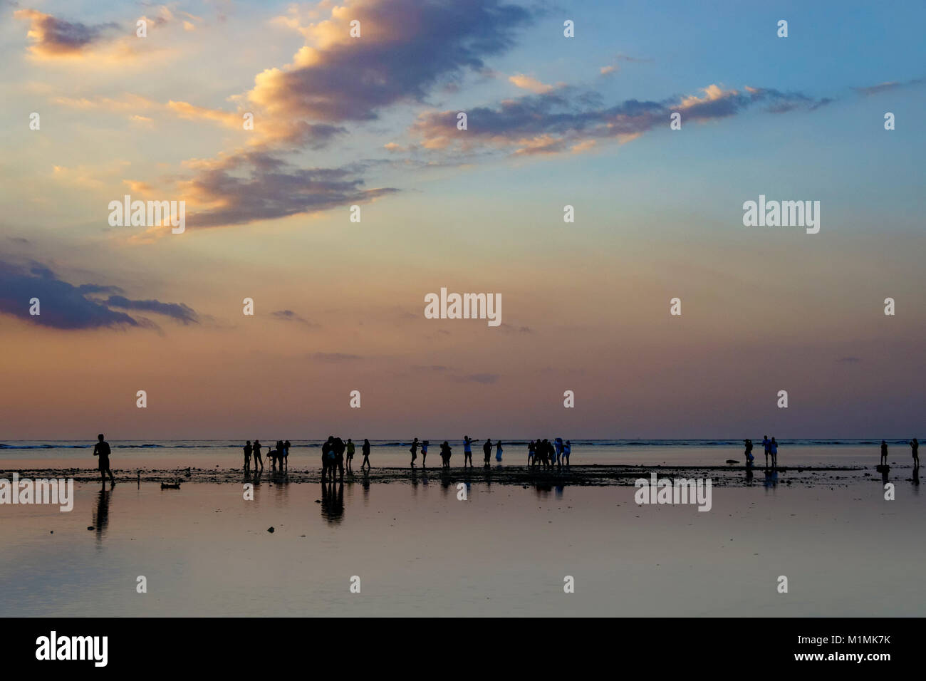 Silhouette of people standing on beach, Gili Trawangan, Lombok Utara, West Nusa Tenggara, Indonesia Stock Photo