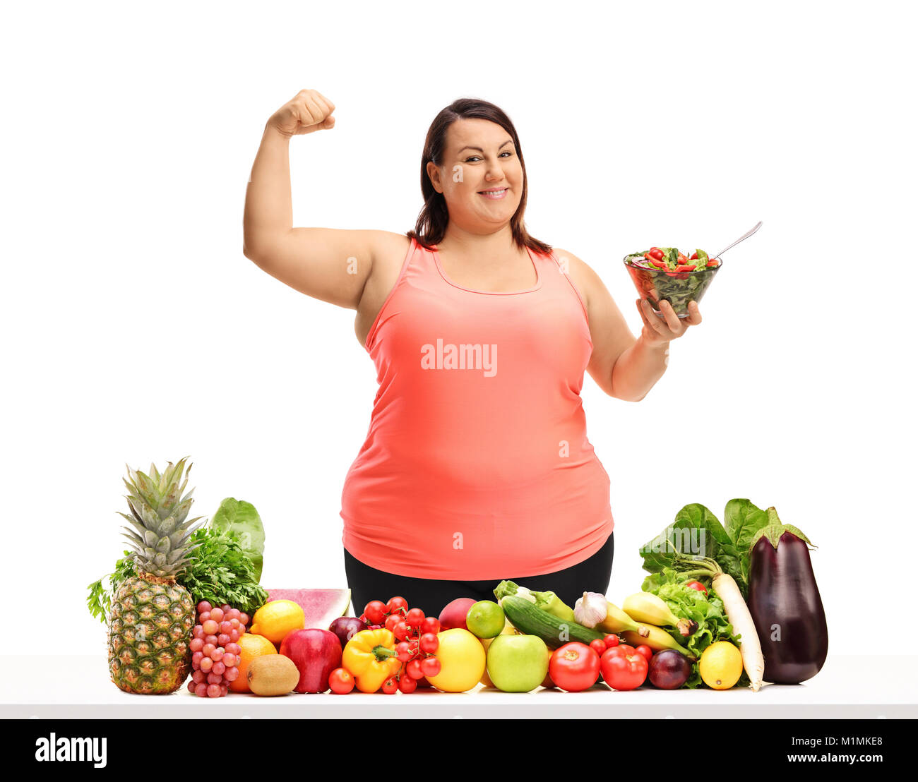 Female athlete flexing biceps, portrait stock photo