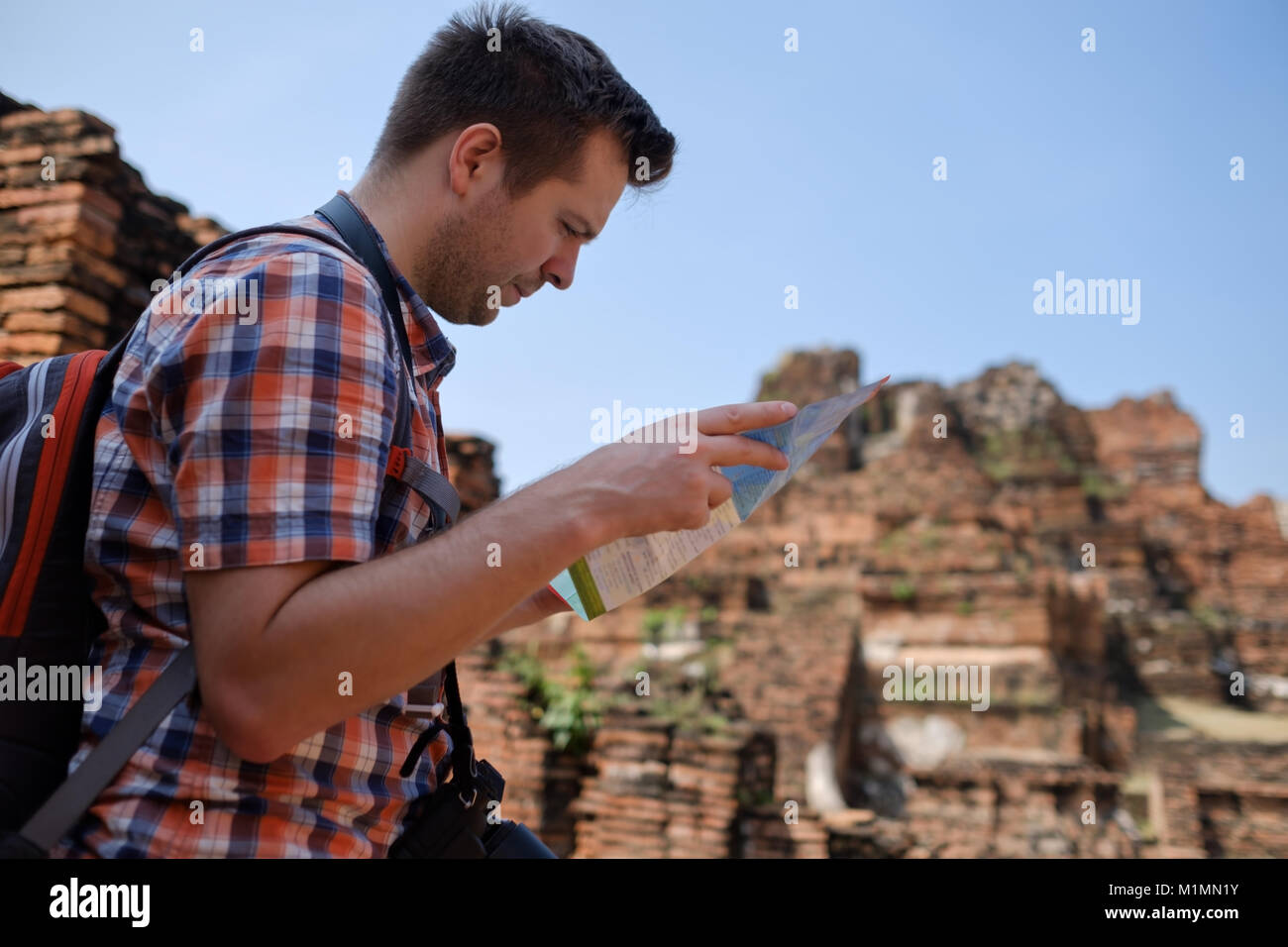 caucasian male tourist with map in asia thailand. Stock Photo