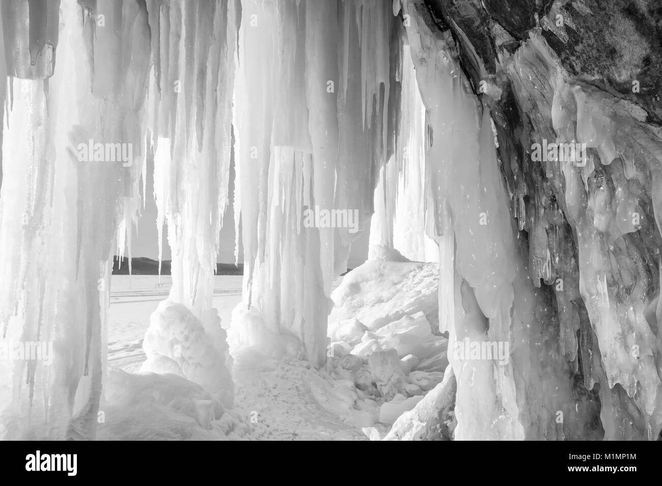 Sun shines on an ice column curtain on Grand Island near Munising Michigan in winter Stock Photo