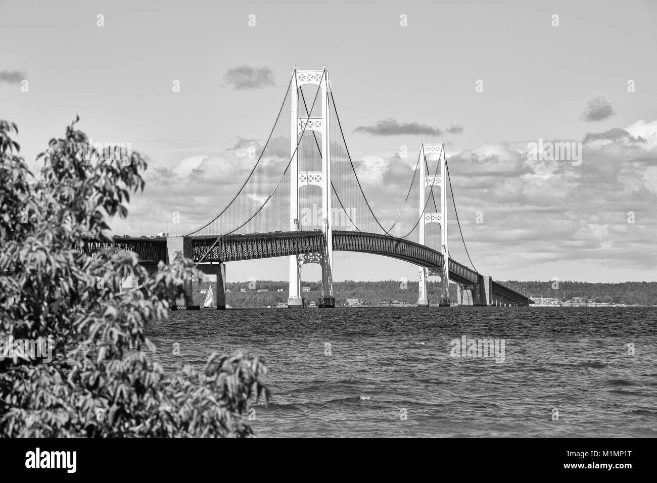 The Mackinac Bridge on a summer day. A suspension bridge spanning the Straits of Mackinac to connect the Upper and Lower Peninsulas of Michigan. Puffy Stock Photo