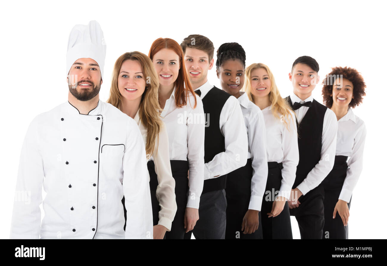 Portrait Of Happy Restaurant Staff Standing In Row Stock Photo