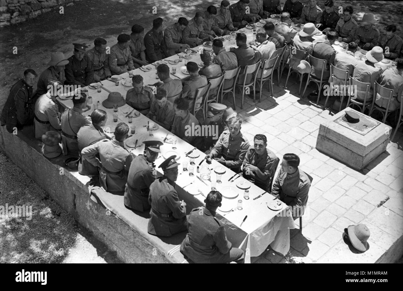 British army soldiers sitting down for lunch in Palestine 1940 Stock Photo