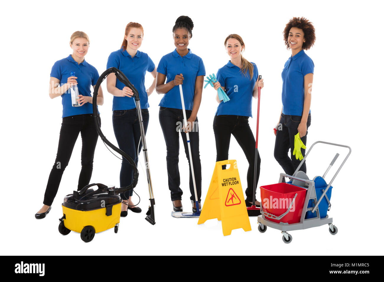 Group Of Smiling Female Janitors With Cleaning Equipment Stock Photo