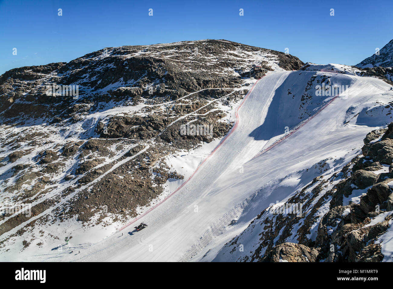 A ski run in the Bernina mountain peaks and the Diavolezza Glacier near St. Moritz, Switzerland, Europe. Stock Photo