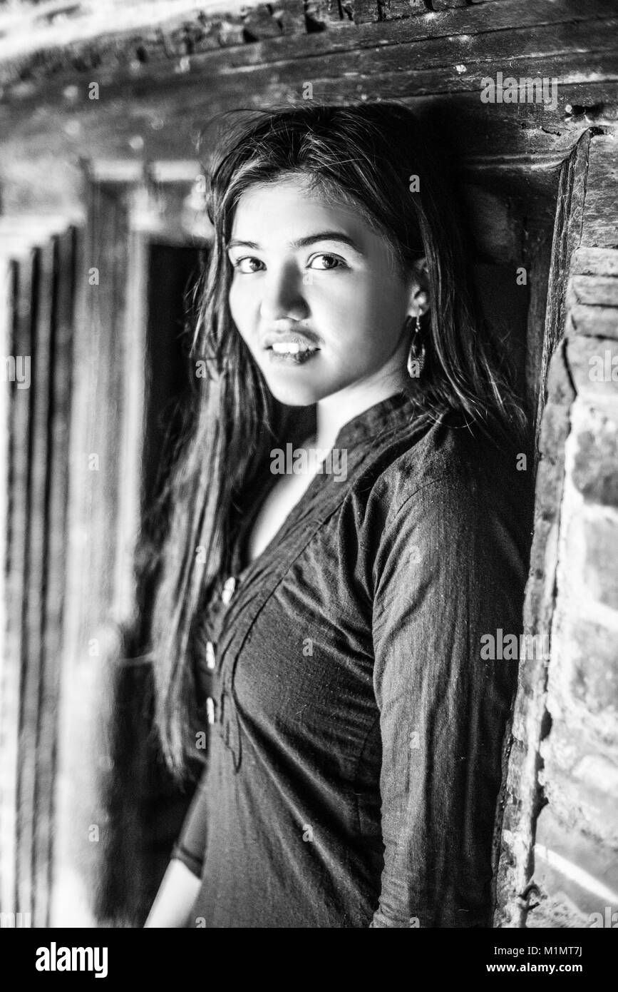 Portrait of a young girl in the old temple in Bhaktapur, Nepal. Stock Photo
