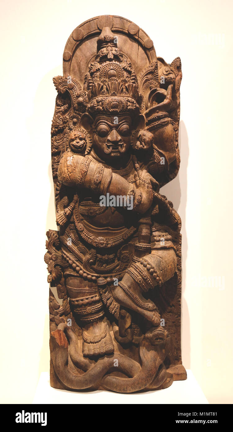 Dvarapala, doorkeeper of a Temple. Carved wood sculpture, 16th-17th centuries. Kerala, south of India. Unknown artist. Stock Photo