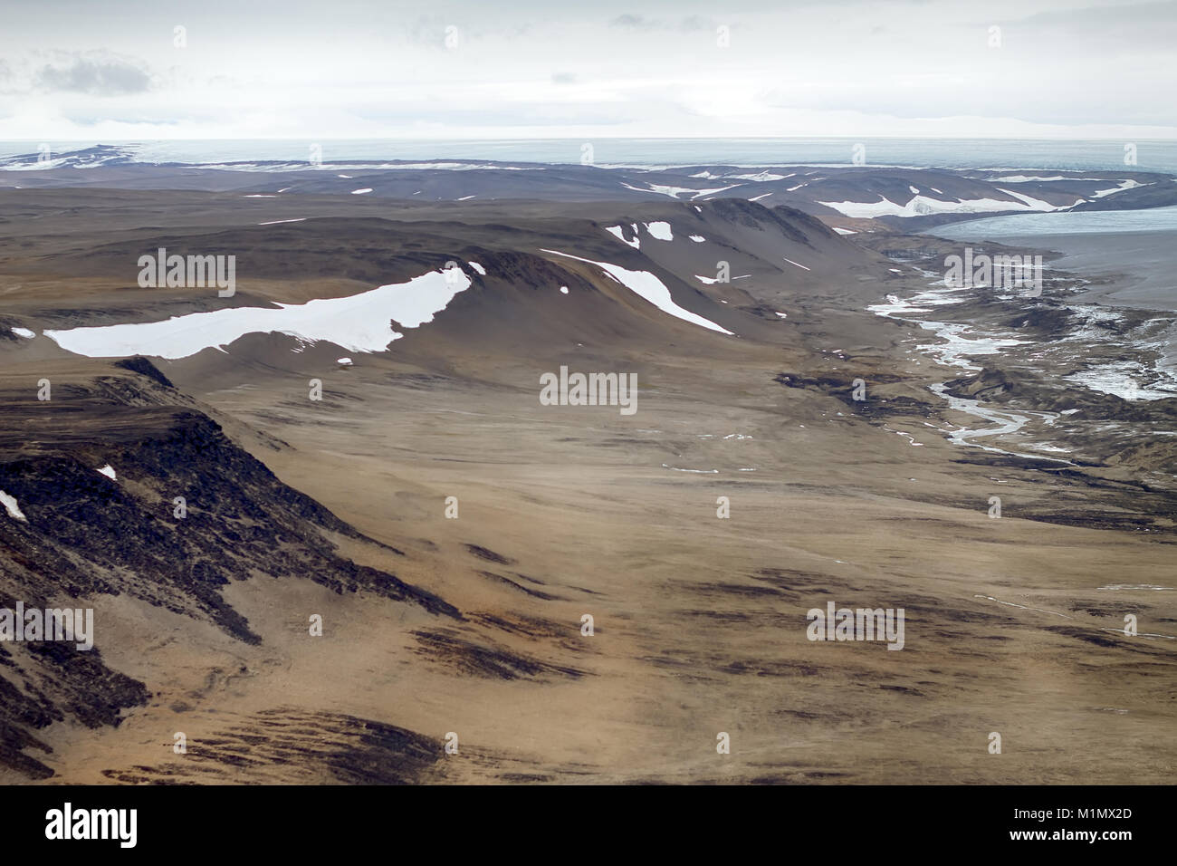 Ancient glacial trough. Regional ablation zone of modern shrinking glacier, moraine boundary (lateral moraine), rotted rocks. Novaya Zemlya Archipelag Stock Photo