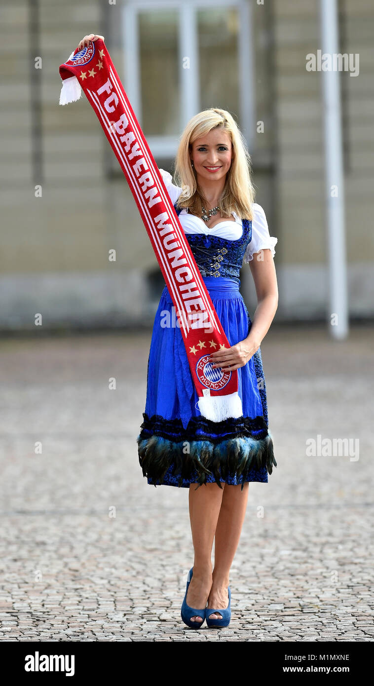 Young woman with a Dirndl, FC Bayern Football scarf, a female fan, Germany, junge Frau mit Dirndl, FC Bayern Fanschal, weiblicher Fan, Deutschland Stock Photo