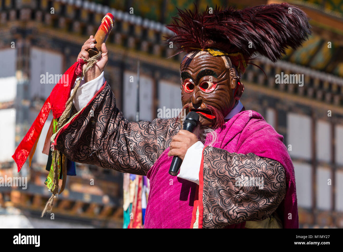 Bumthang, Bhutan.  An Atsara (Clown, Jester) Performs during Warm-up for a Religious Ceremony at Jambay Lhakhang (Monastery/Temple), near Jakar.  He i Stock Photo