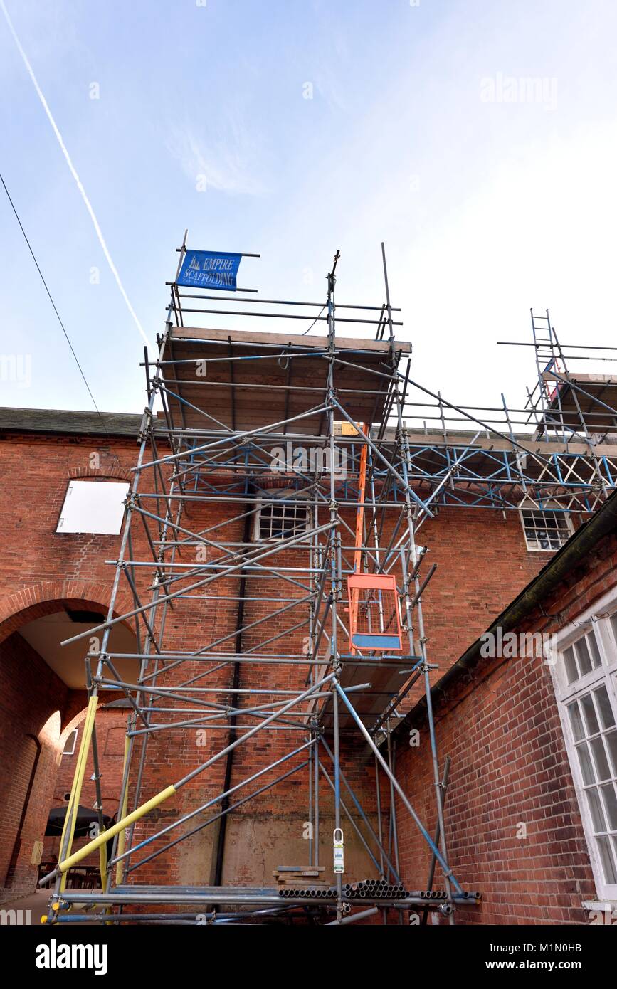 Scaffolding being used to renovate an old building Stock Photo