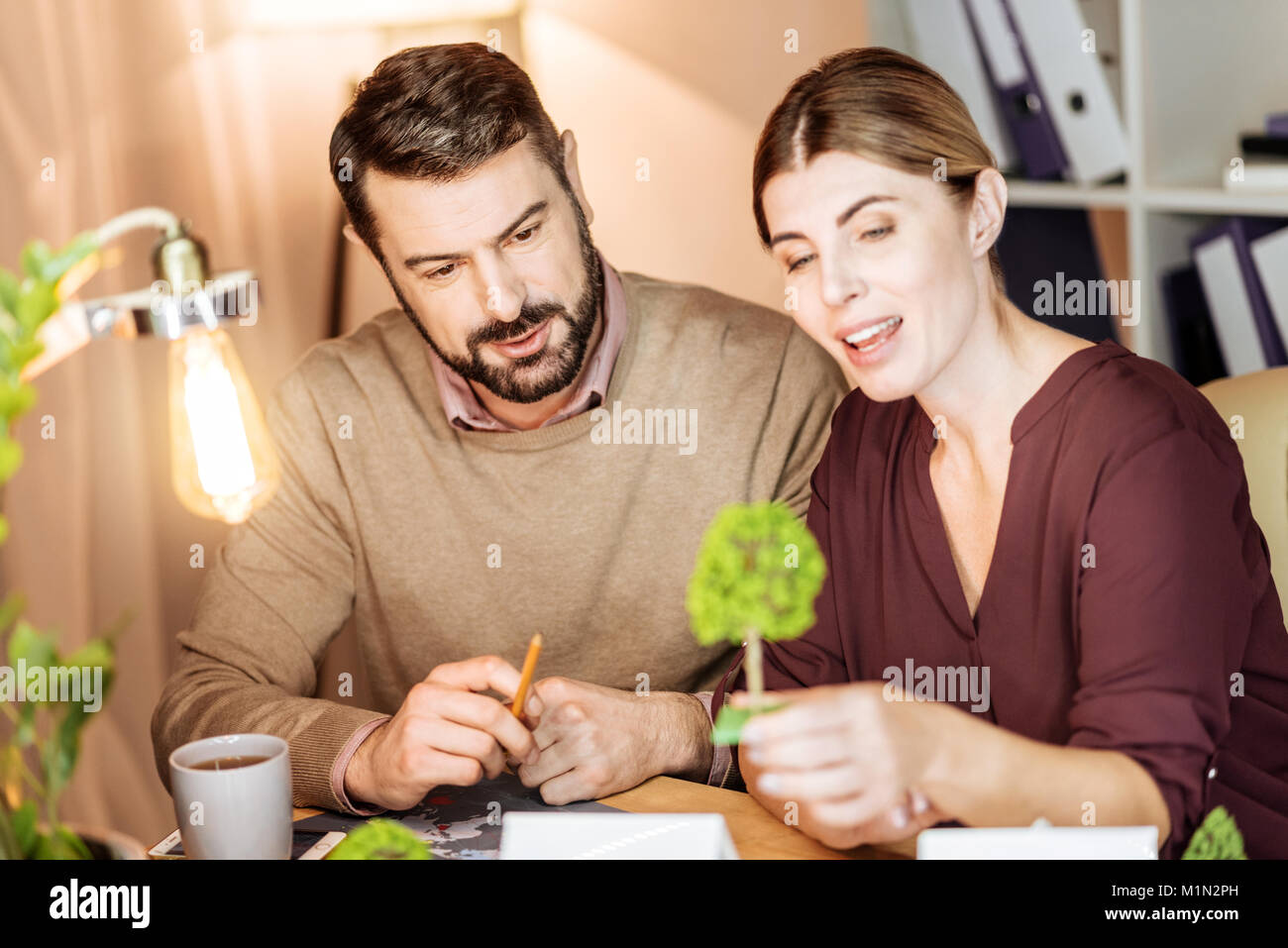 Explaining project to colleagues hi-res stock photography and images ...