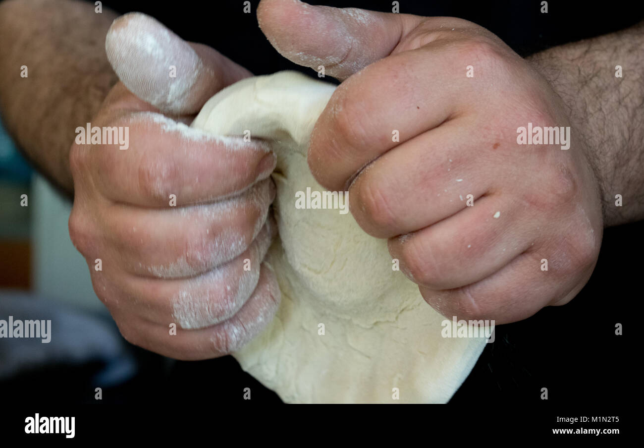 Pizza dough kneading Stock Photo Alamy