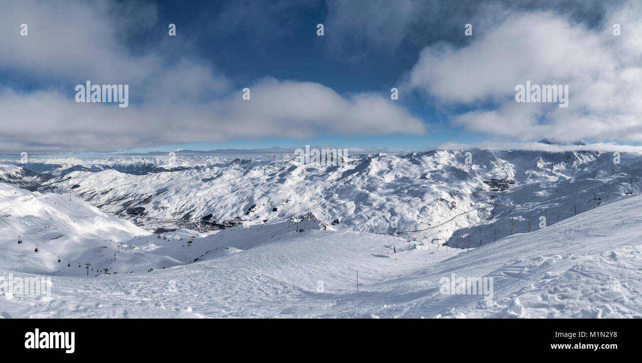 Panoramic view of the Belleville Valley from La Masse showing both Les Menuires and Val Thorens across the valley after fresh snow. Stock Photo