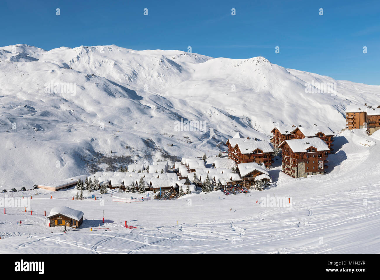 Chalets, hotels and restaurants in the Reberty area of the French ski resort of Les Menuires in the Three Valleys ski area. Stock Photo