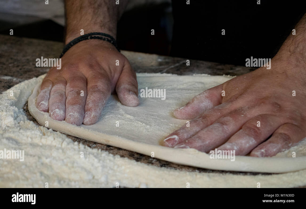 Pizza dough kneading Stock Photo Alamy