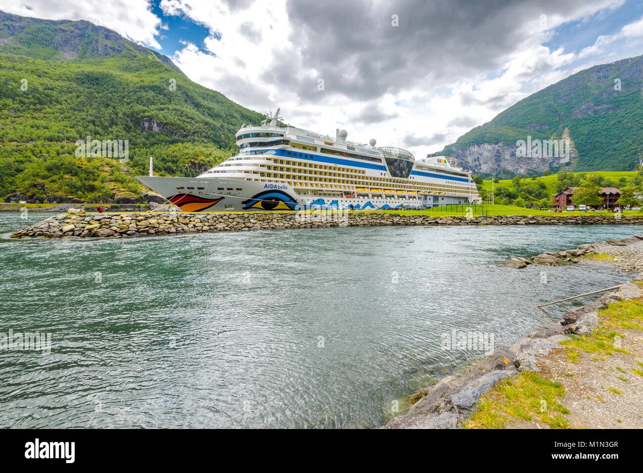 cruise ship of AIDA Cruises anchors in Flam, Aurland, Norway, Scandinavia, Aurlandsfjorden, Sognefjorden, travel stage in the fjord Stock Photo