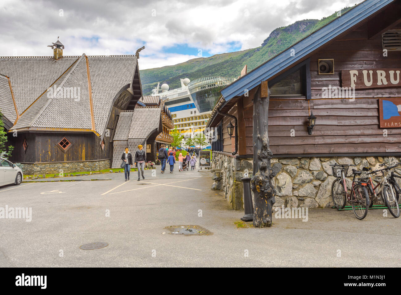 cruise ship of AIDA and touristy centre of Flam, Aurland, Norway, Scandinavia, Aurlandsfjorden, Sognefjorden, passengers visiting Flam Stock Photo