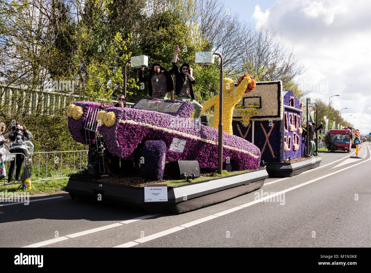 The annual flower parade involving twenty large floats plus 30 smaller vehicles, decorated in a riot of colour using freshly cut tulips and other spri Stock Photo