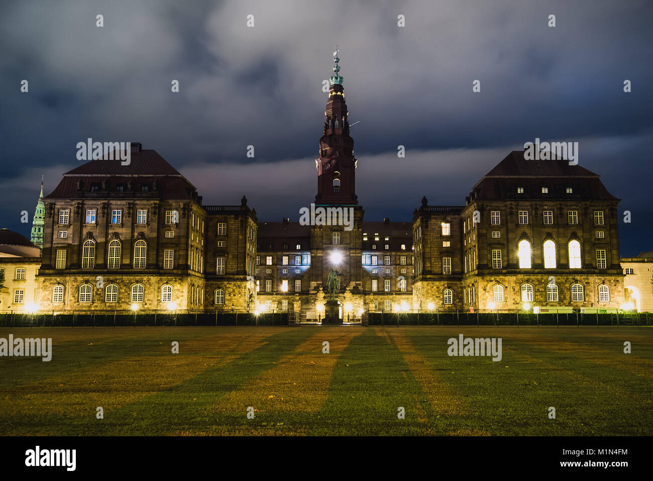 Christiansborg Palace in central Copenhagen at night. Cristiansborg castle in Denmark. Night lights and shadows wide angle view. Stock Photo