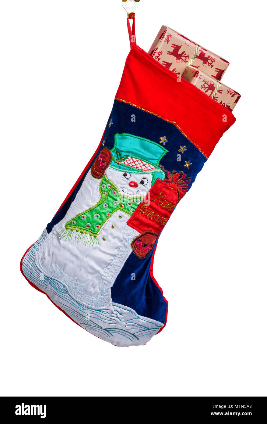 Traditional Christmas or Xmas stocking, filled with gift wrapped presents or gifts. Stock Photo