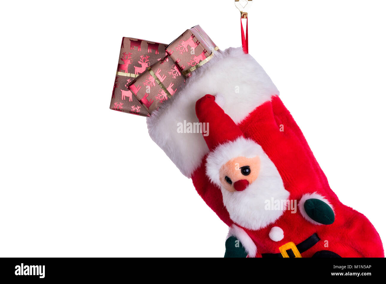 Traditional Christmas or Xmas stocking, filled with gift wrapped presents or gifts. Stock Photo
