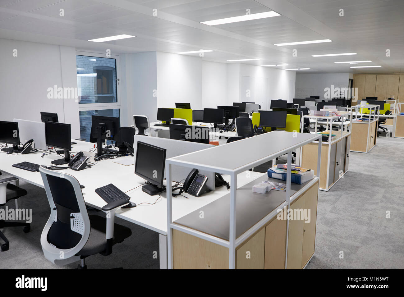 Empty open plan office with multiple work stations Stock Photo