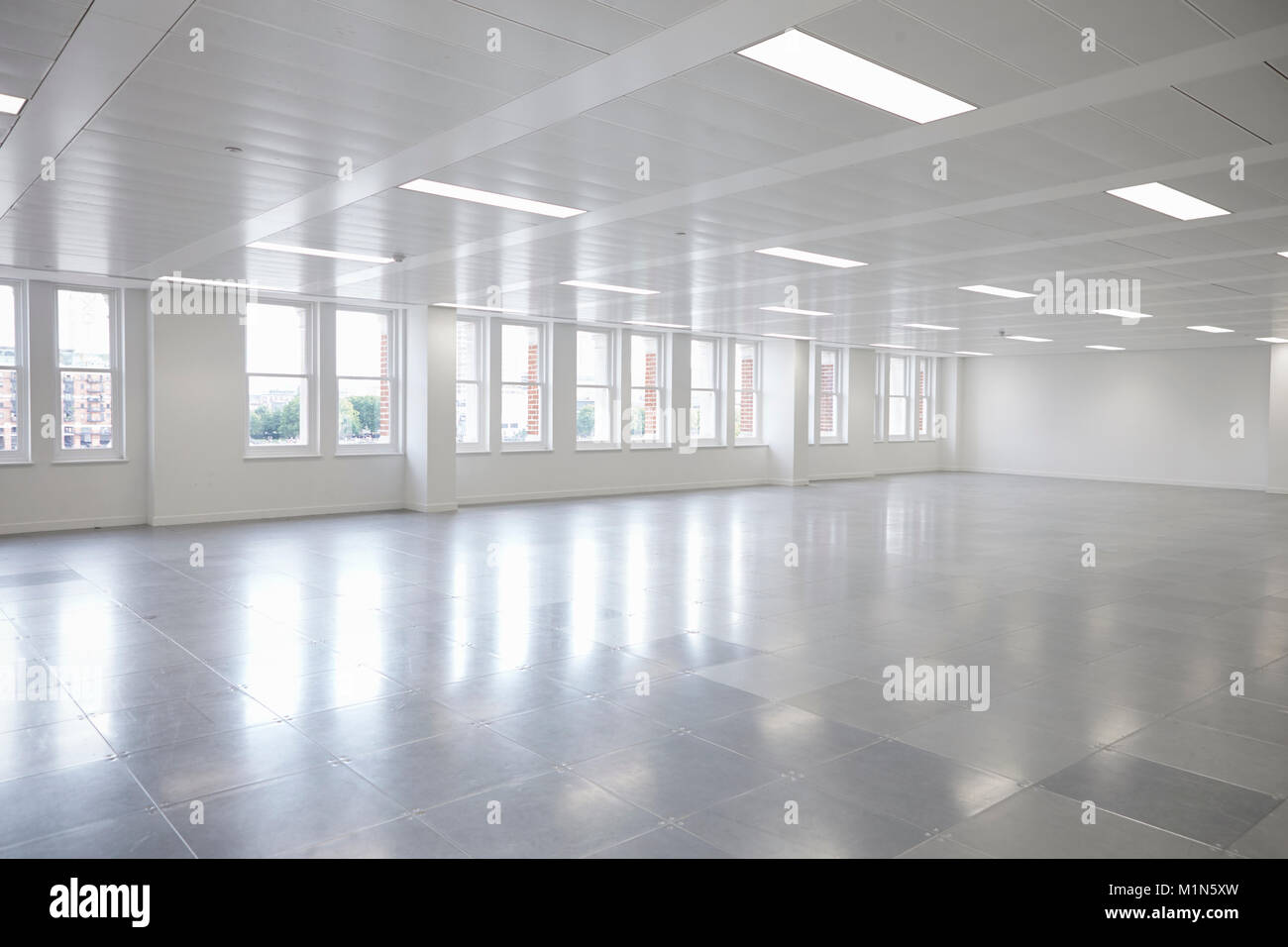 Vacant open plan office space with windows Stock Photo