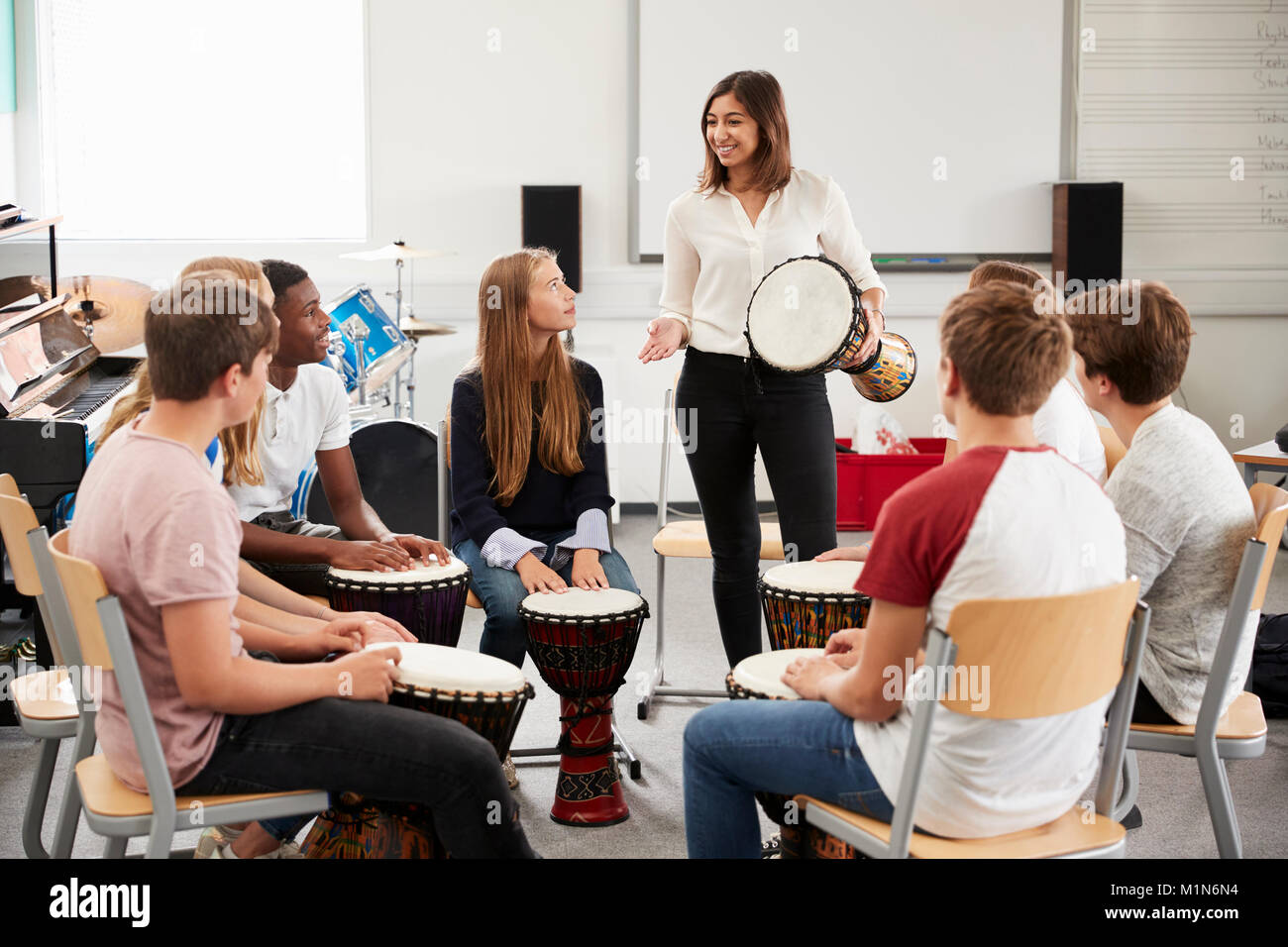 Teenage Students Studying Percussion In Music Class Stock Photo