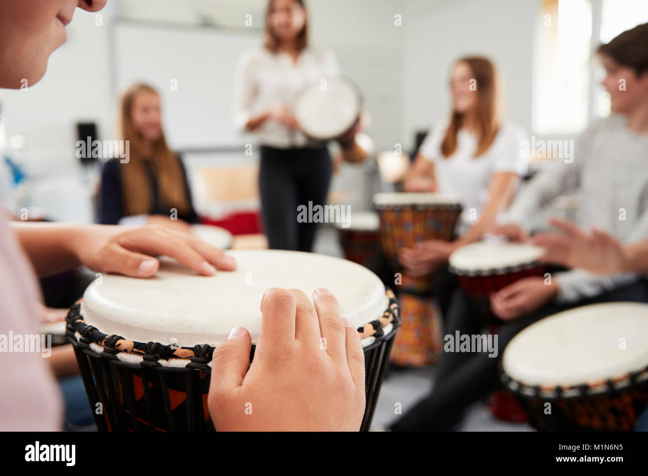 Teenage Students Studying Percussion In Music Class Stock Photo