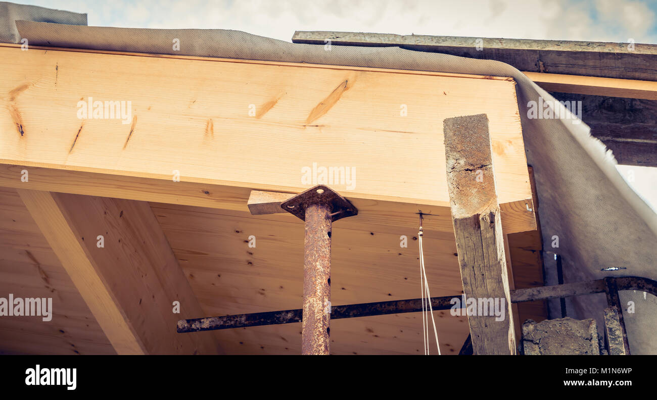 shoring post that keeps a roof under renovation in france Stock Photo