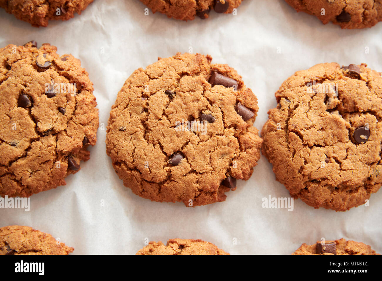 Display Of Freshly Baked Choc Chip Cookies In Coffee Shop Stock Photo