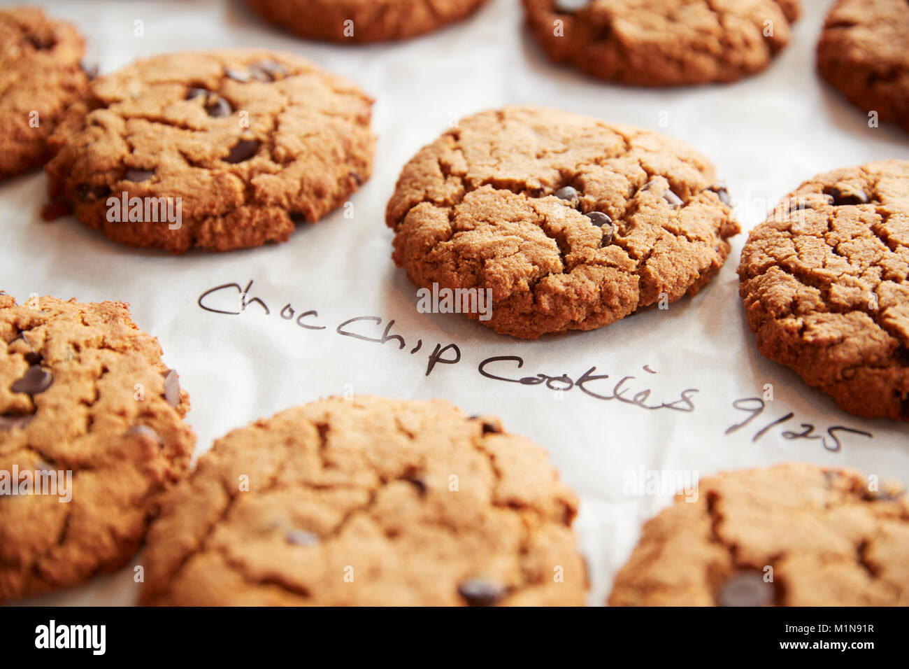 Display Of Freshly Baked Choc Chip Cookies In Coffee Shop Stock Photo