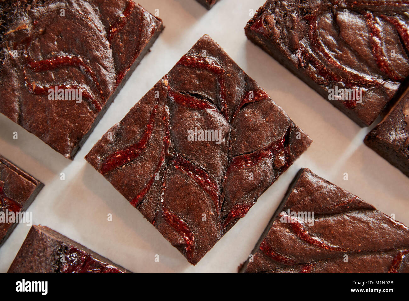 Display Of Freshly Baked Raspberry Swirl Brownies In Coffee Shop Stock Photo