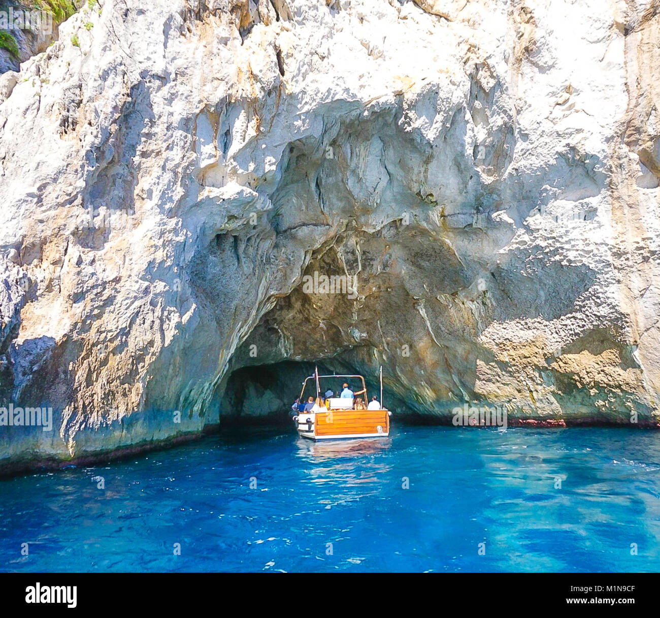 The White Grotto of the island of Capri, Italy. Coastal Rocks on the Mediterranean Sea at Capri Island from a motor boat tour. Stock Photo