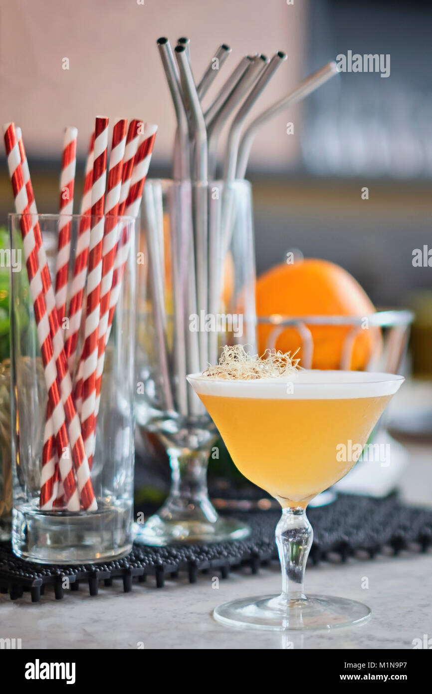 Cocktail bar with gin cocktail and bar accessories. Stock Photo