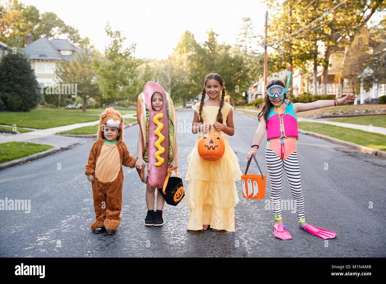 Children Wearing Halloween Costumes For Trick Or Treating Stock Photo ...